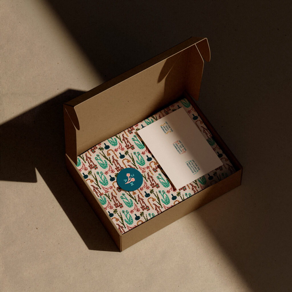 Box with patterned paper and brand stickers.