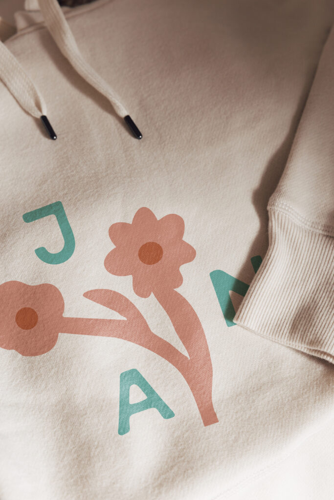 Sweater featuring a floral logo design.