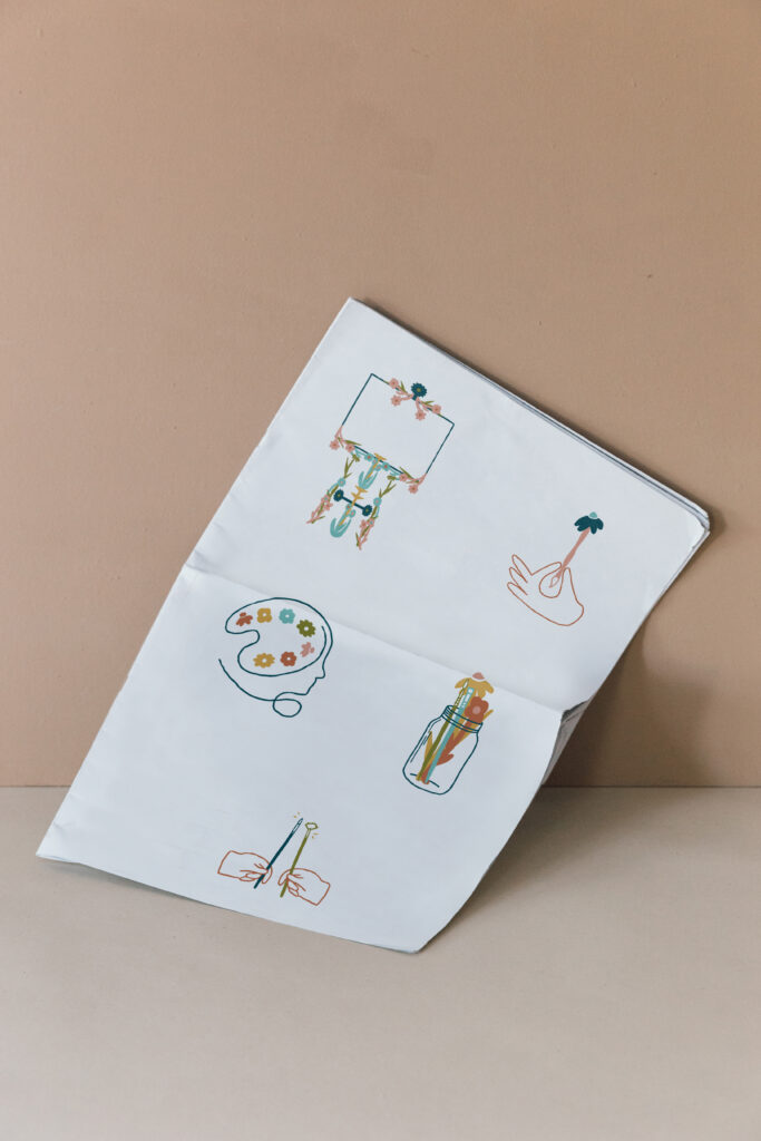 Paper mockup with illustrations for an artist brand.