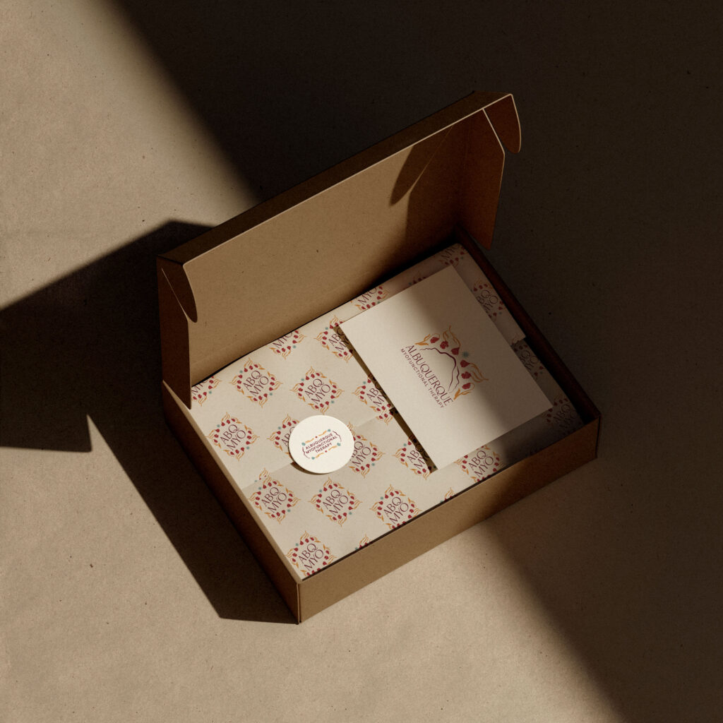 A box containing branded stationery items for Albuquerque Myofunctional Therapy.