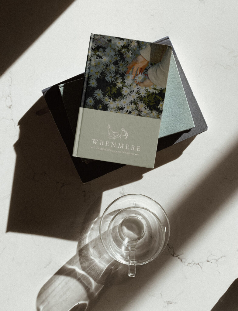Book mockup featuring the Wrenmere branding design.