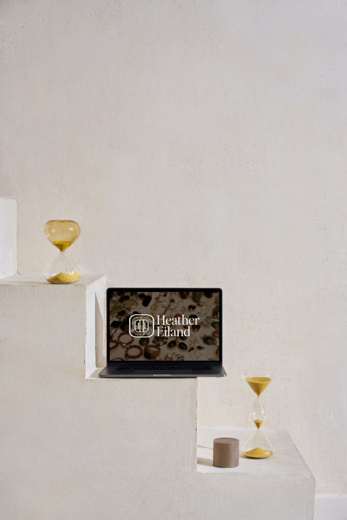 Heather Eiland logo shown on a laptop screen mockup.