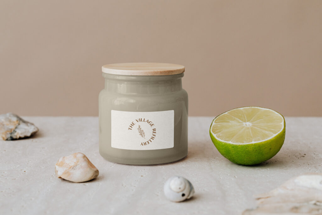 Skincare jar with a simple label featuring the Village Refillery logo.