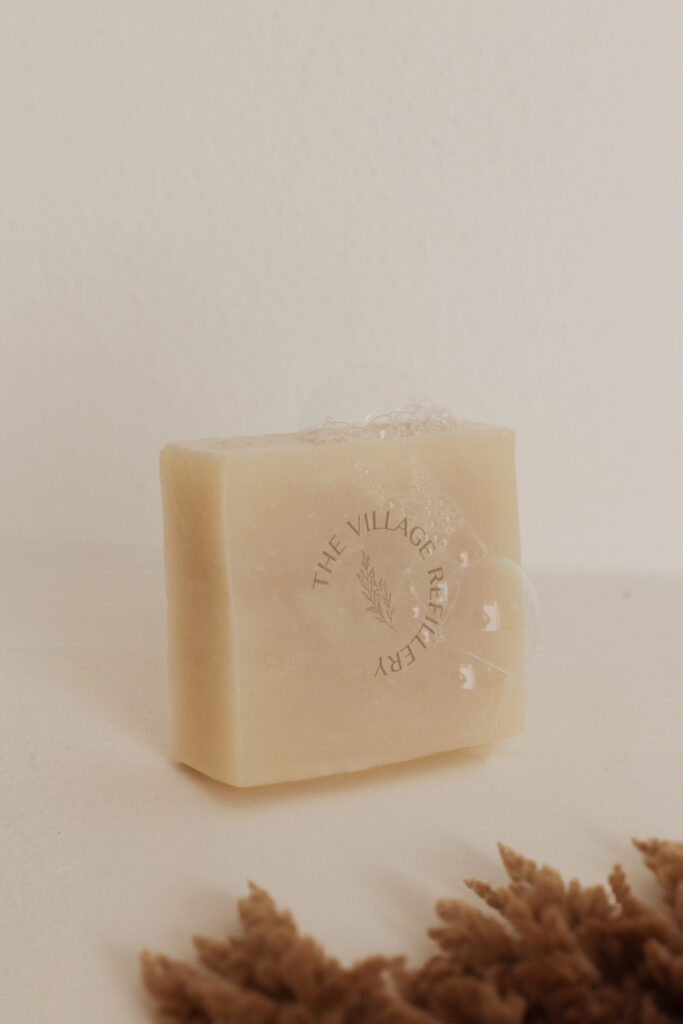 Organic brand logo design engraved in a soap bar.