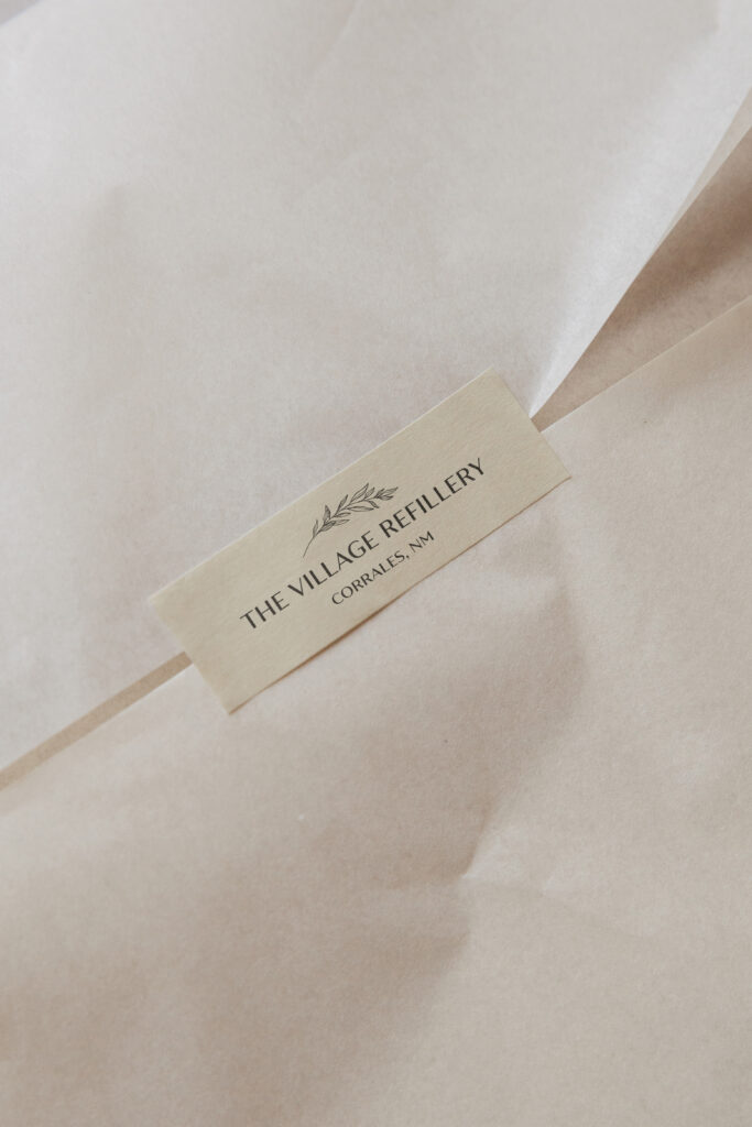 Village Refillery logo printed on tape.