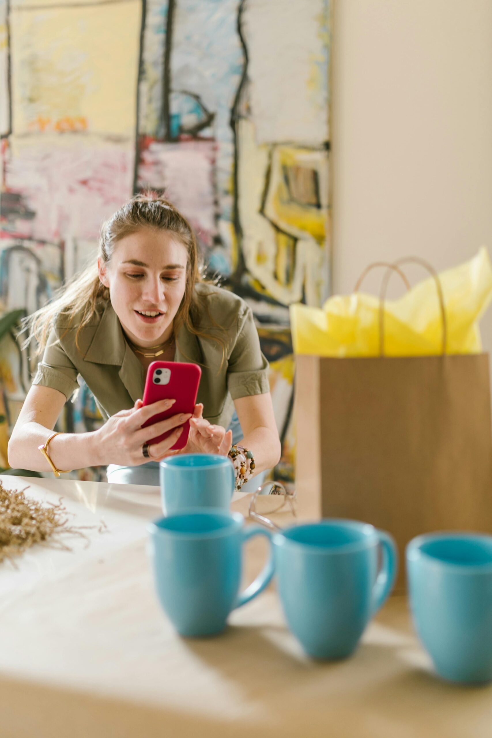 Woman photographing products for her small business marketing.