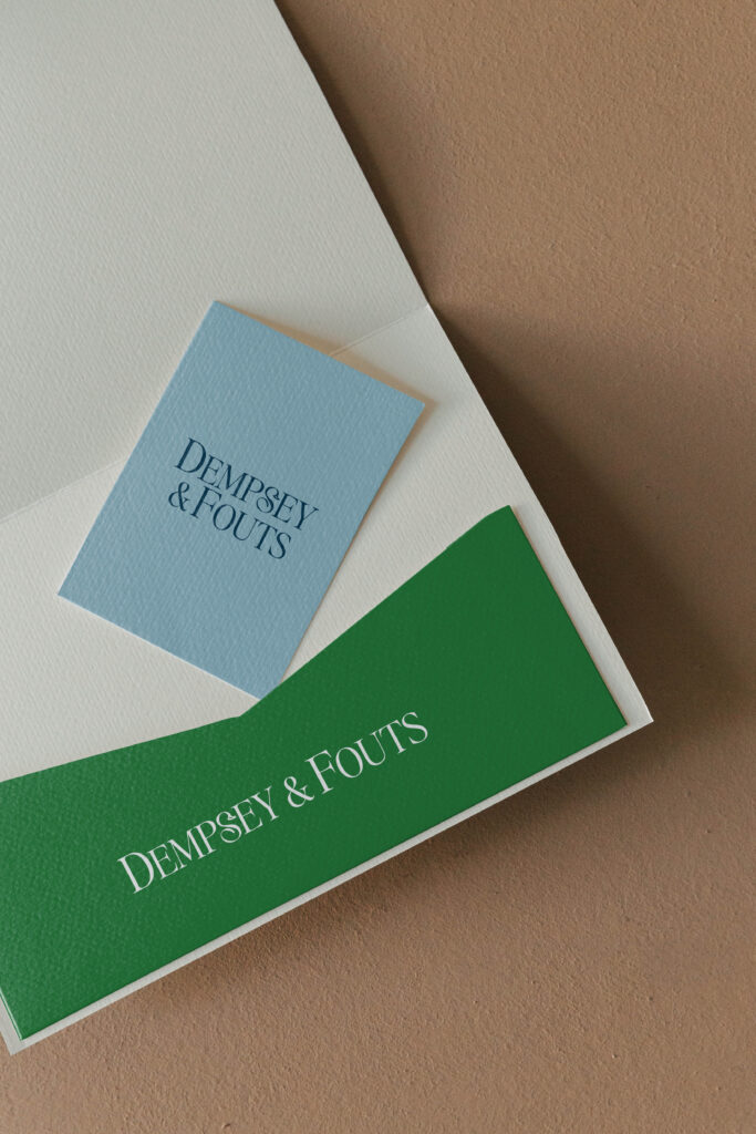 Dempsey & Fouts logo design displayed on envelope and card for Phoenix law firm branding.