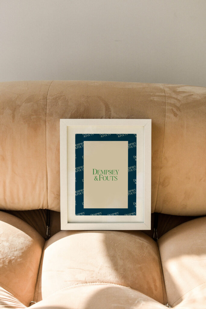 Framed mockup featuring the Dempsey & Fouts law firm brand identity.
