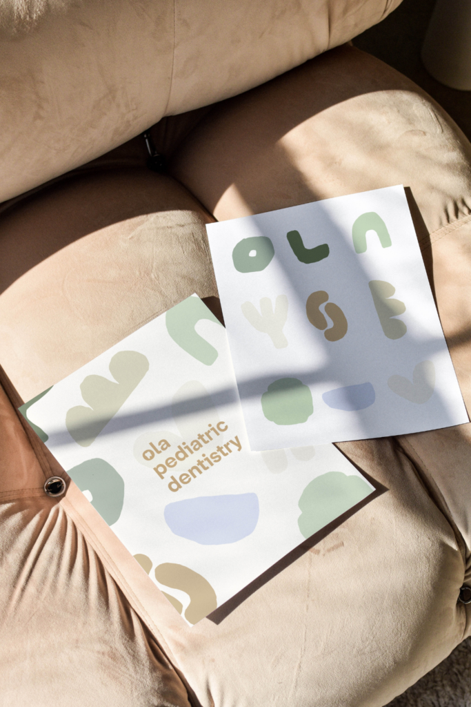 Organic blob illustrations used in a dentist brand identity.