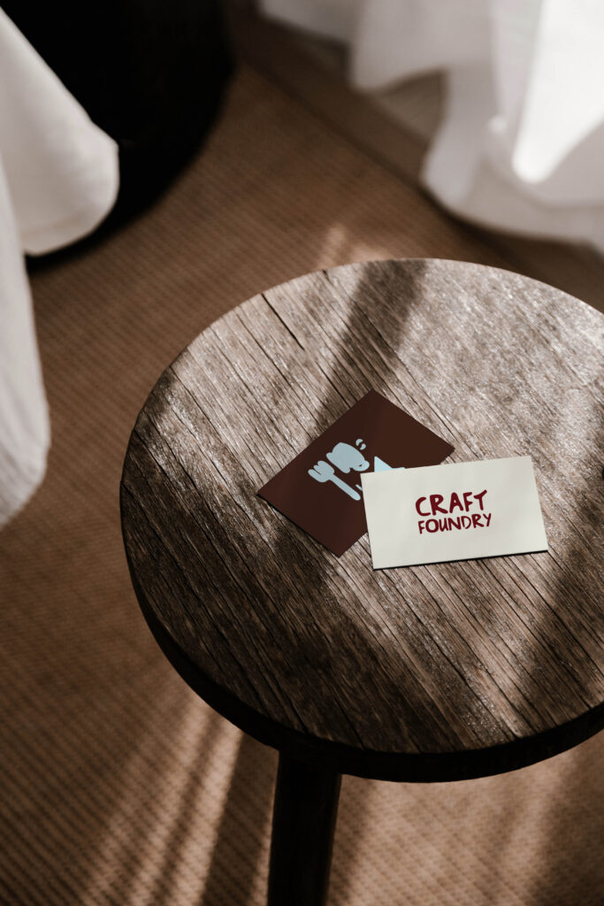 Craft Foundry logo and icons presented on a table, creating a natural, organic feel.