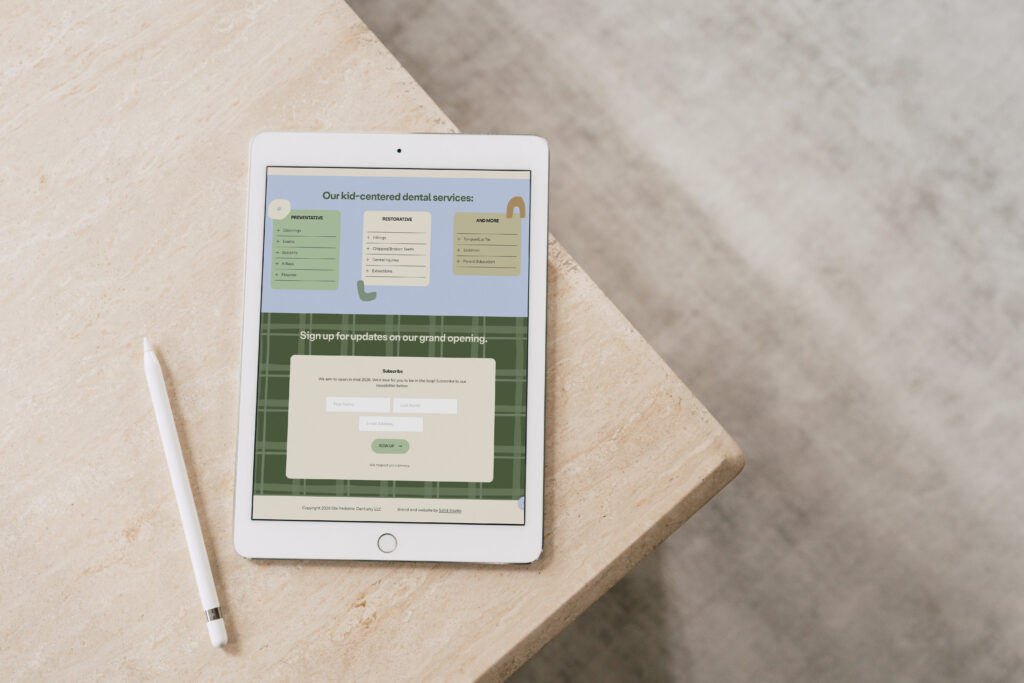 Children’s dentist website with a playful design displayed on a tablet screen.