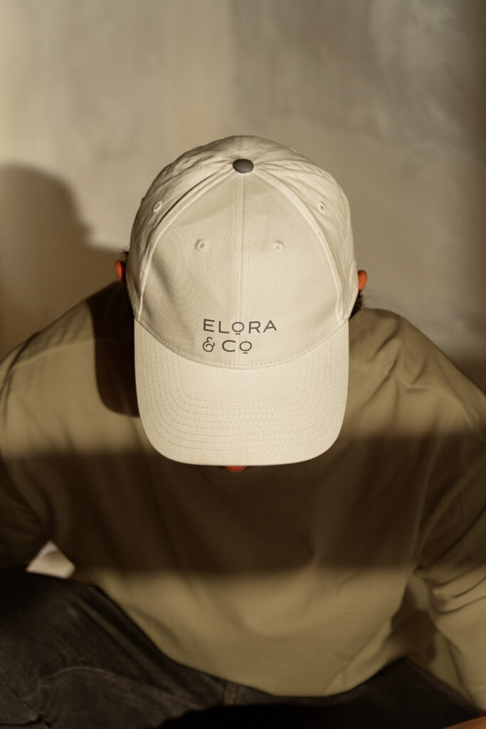 A cap featuring the Elora & Co. logo.
