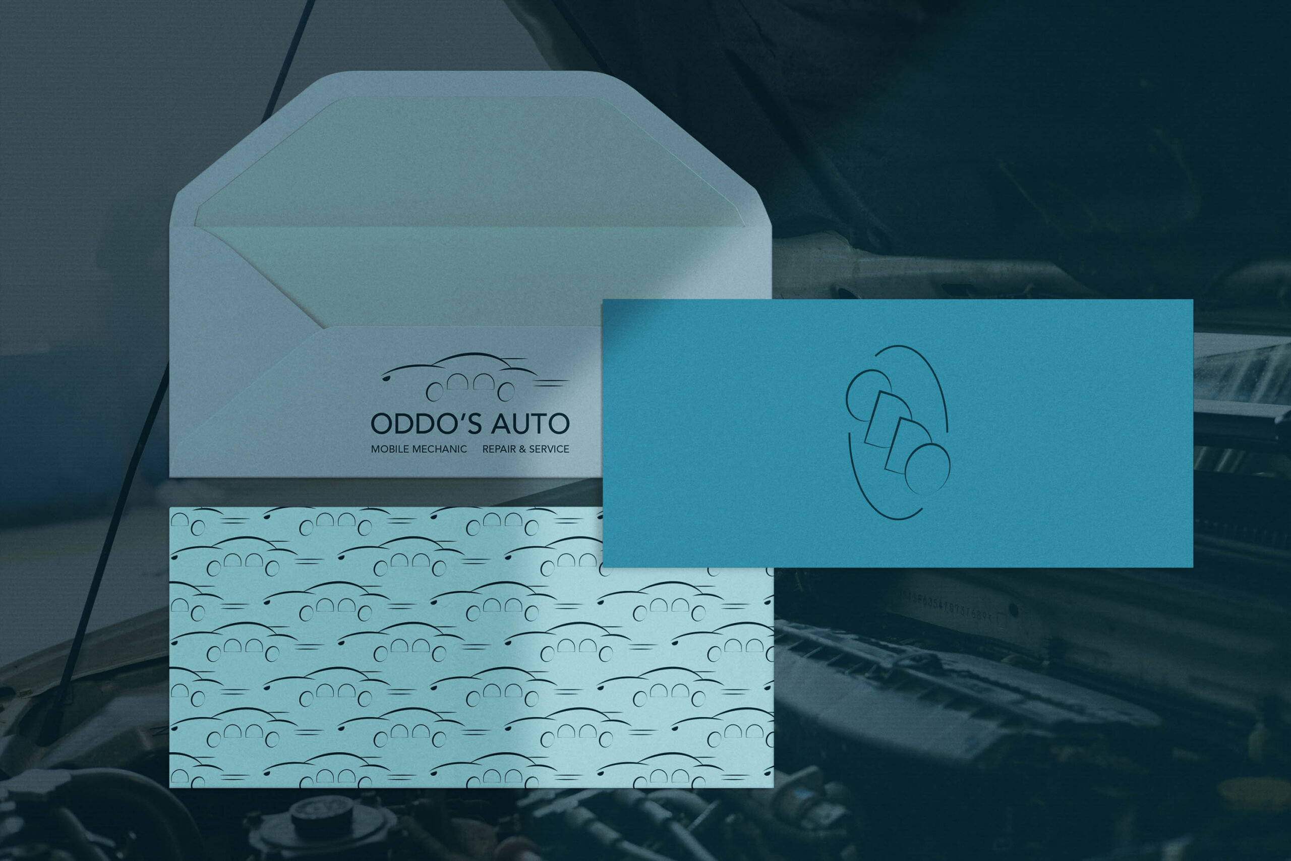 Stationery set with a mobile mechanic logo and patterned design.