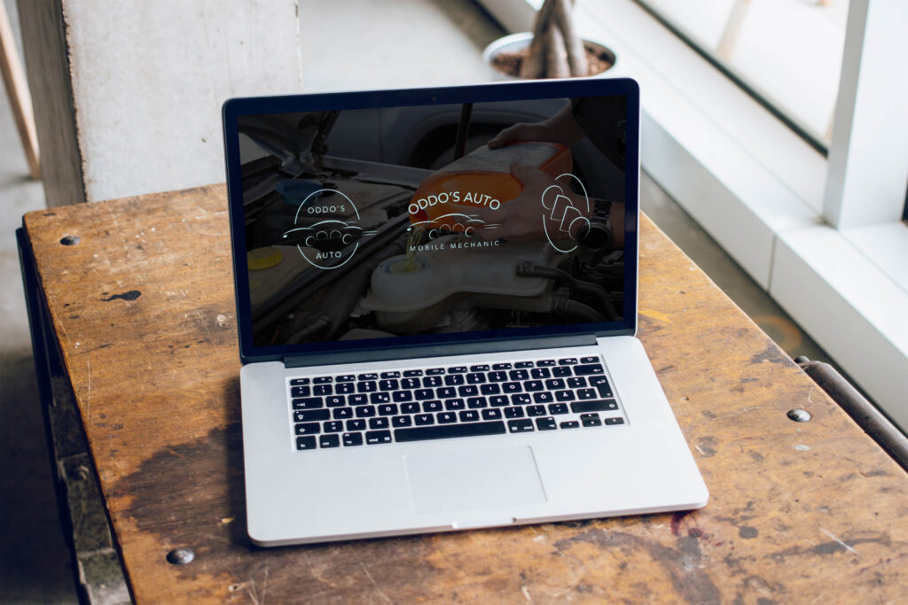 Mobile mechanic logo design featured on a laptop screen.