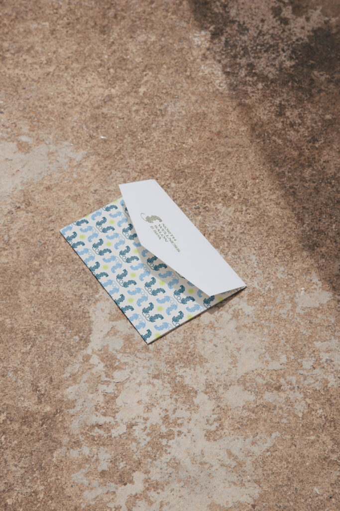 Stationery envelope with the North Wellness brand pattern and logo, designed for a wellness business.