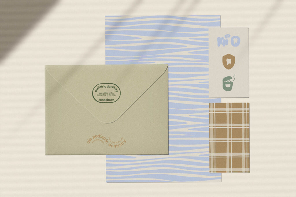 Stationery mockup featuring calm logo design and textures for a pediatric dentist.