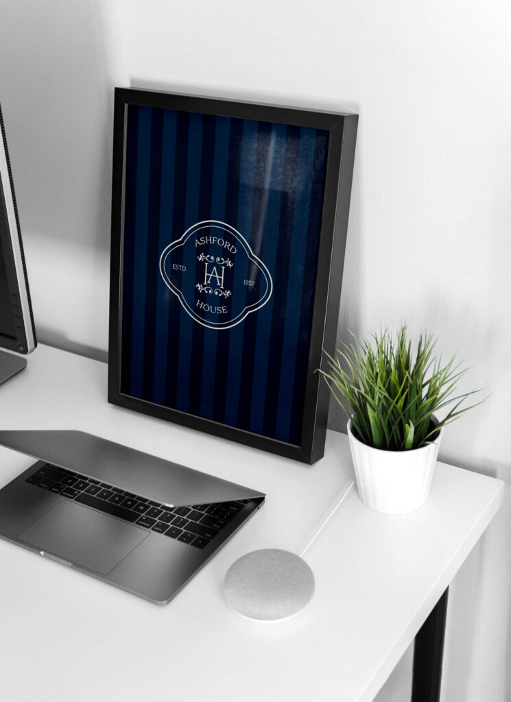 Ashford House main logo displayed on a feature frame with a royal blue striped background, giving it a refined, classic feel.