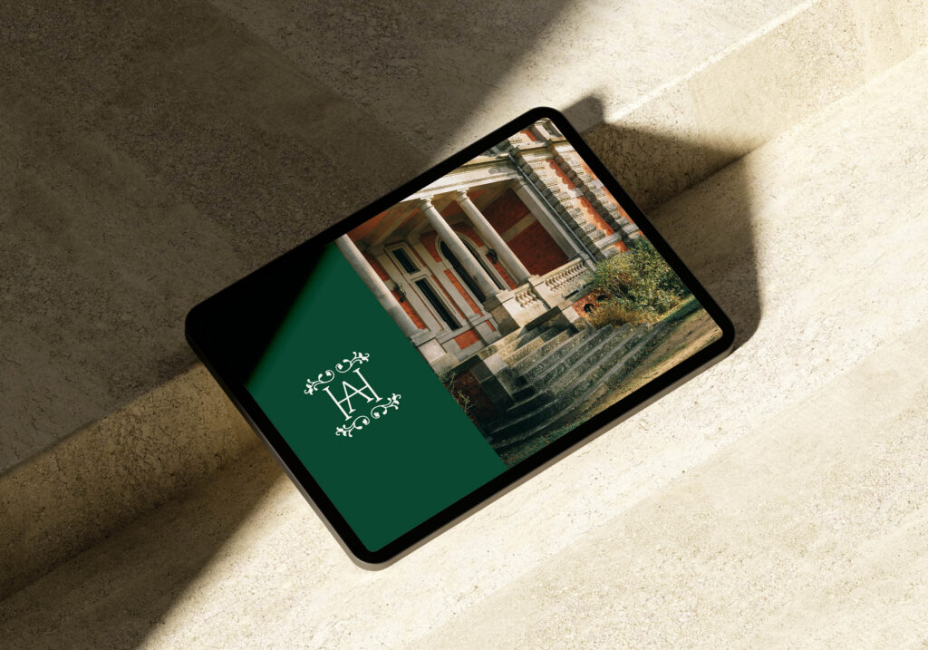 A heritage-inspired brand kit featuring a sophisticated logo on a tablet screen for legacy business.