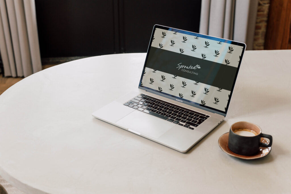 Minimal logo and branded pattern for consultant branding shown on a laptop.