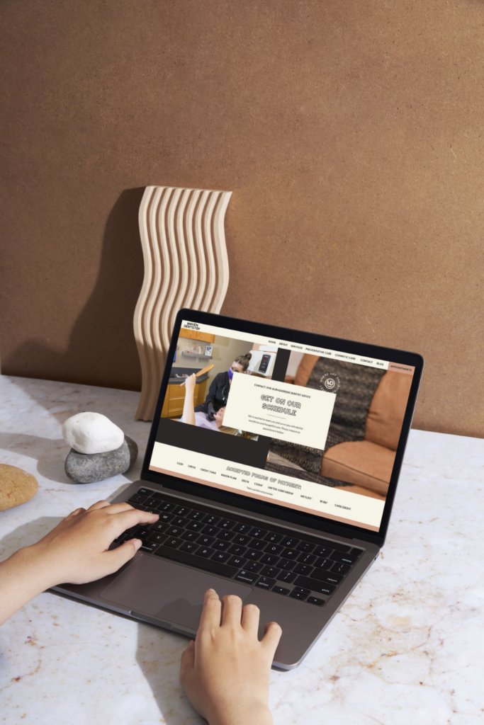 Maven Dentistry's website contact page displayed on a laptop screen.