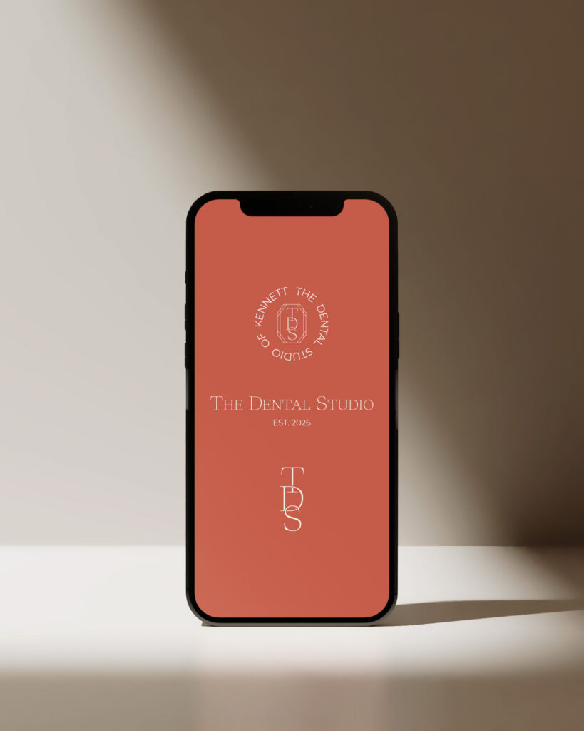 The Dental Studio logo variation displayed on a phone screen.