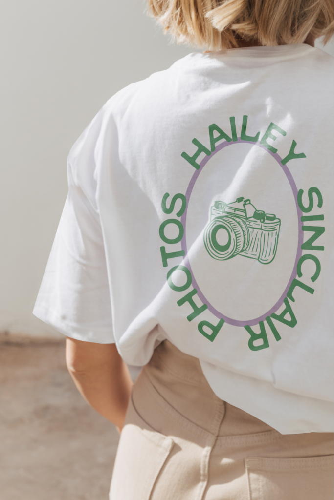 Photography logo submark with a hand-drawn camera illustration for Hailey Sinclair